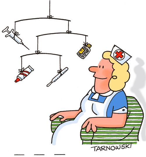 Nurse with a mobile made from medicines.