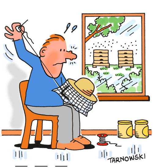 Bee keeper repairing his hat.