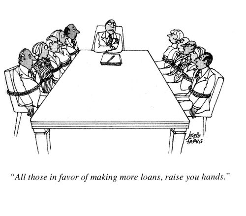 'All those in favor of making more loans, raise your hands.' (staff's hands are tied to chairs).