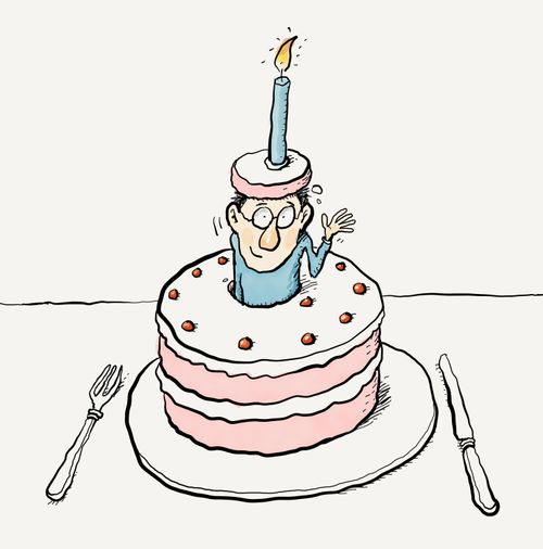 A little man emerging from a birthday cake