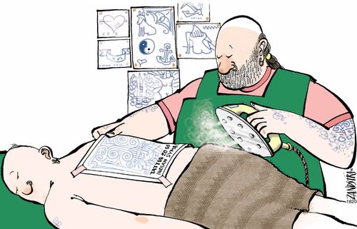 Tattooist ironing on a design.