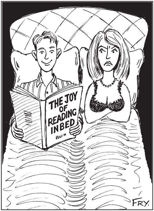 Annoyed woman in bed with man reading book entitled: 'The Joy Of Reading In Bed'.
