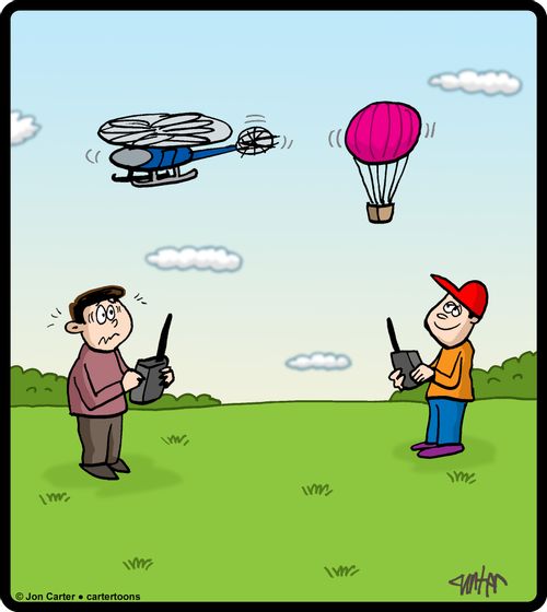 One boy flies remote control helicopter, another flies remote control air balloon.