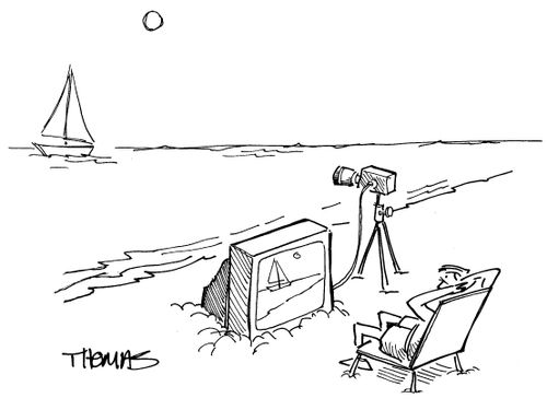 Guy on beach watching scenery on tv screen.