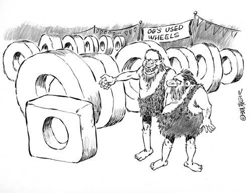 Prehistoric salesman in used tire lot.