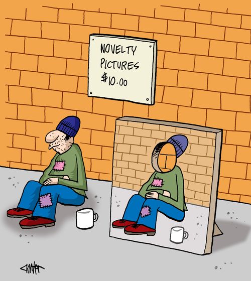 Beggar sitting on sidewalk with a cutout for taking tourist novelty pictures for money.