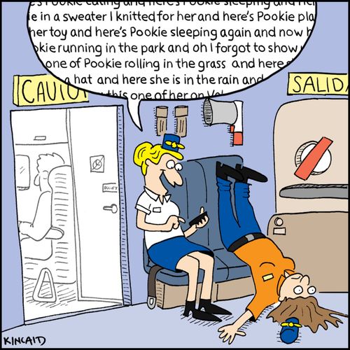 A chatting flight attendant wears out another with hundreds of dog photos.
