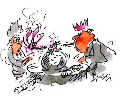 Blowing out the Christmas Pudding.