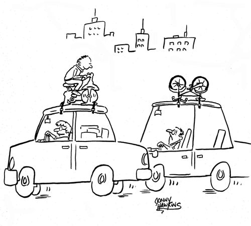 Man in car with bike on top sees car with man on exercise bike on top.