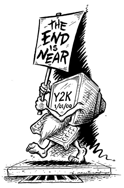 Computer with Y2K on screen carring a 'End is Near' sign