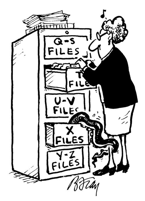Woman going through files being grabbed by weird creature in X Files.