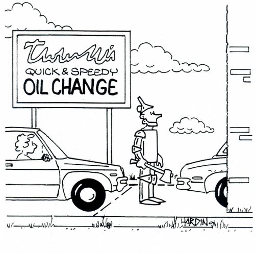Tin man visits automotive oil change facility.