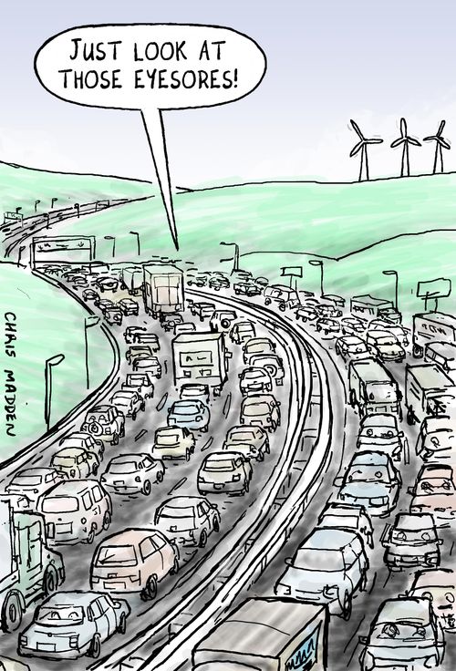Wind turbines seen as a blot on the landscape by motorists who don't notice the impact of the motorway.