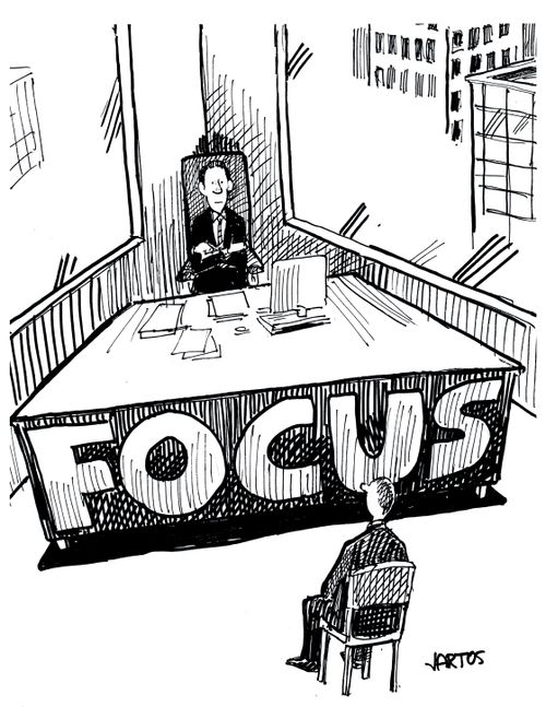 The back of a boss' desk which reads 'Focus'.