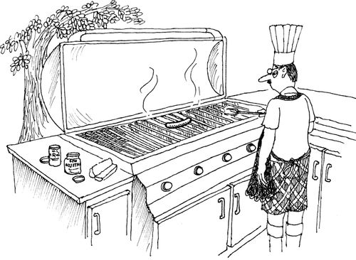 Man cooking a single sausage on a very large barbeque.