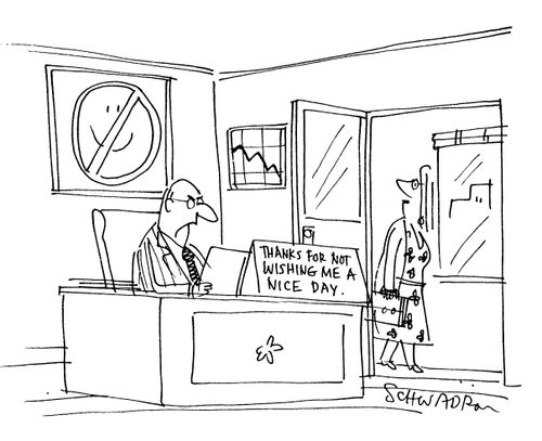 Sign on desk reads: 'Thanks for not wishing me a nice day.'