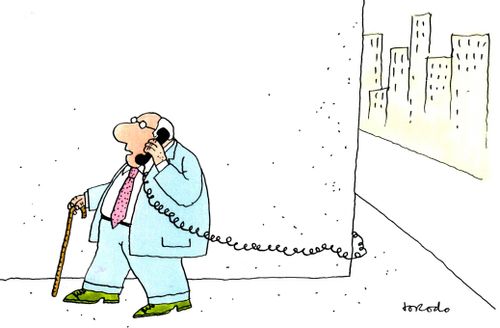 Senior citizen using landline phone as a mobile