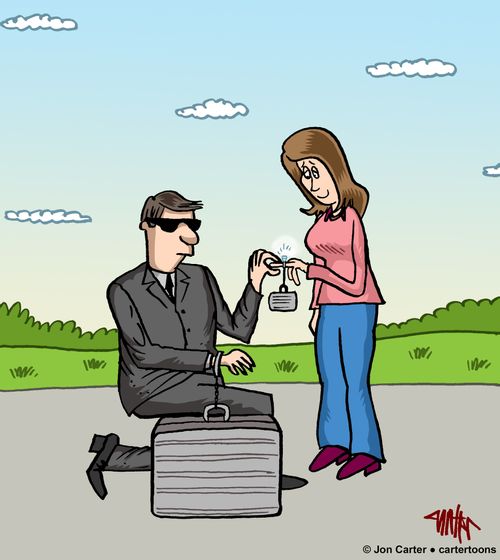 Agent with security case proposes to girlfriend with ring that has a tiny security case chained to it.