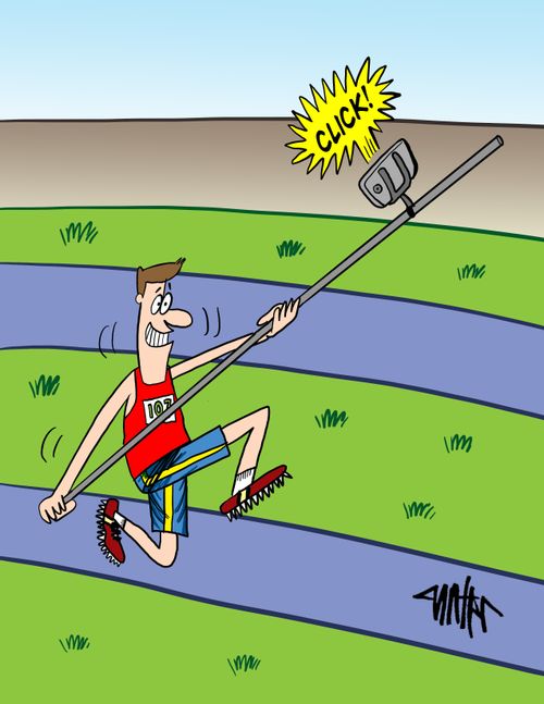 Pole vaulter uses his pole as a selfie stick while he gets ready to jump.