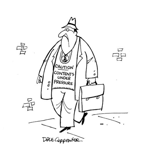 Man with jumper reading 'Caution - Contents under pressure'.