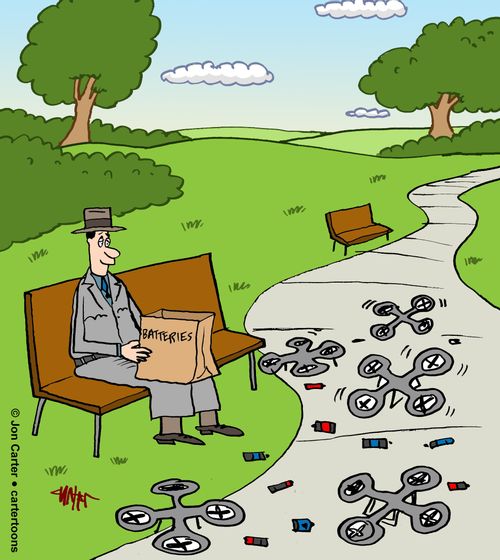 Man Sitting On Park Bench Feeding Batteries To Drones.