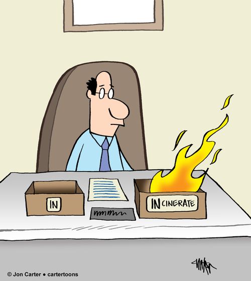 Office worker sitting at desk with inboxes labeled "IN' and "INcinerate.'