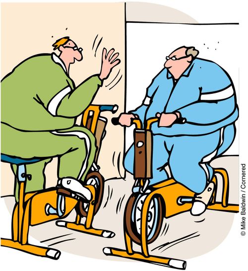Exercise bikes passing each other.