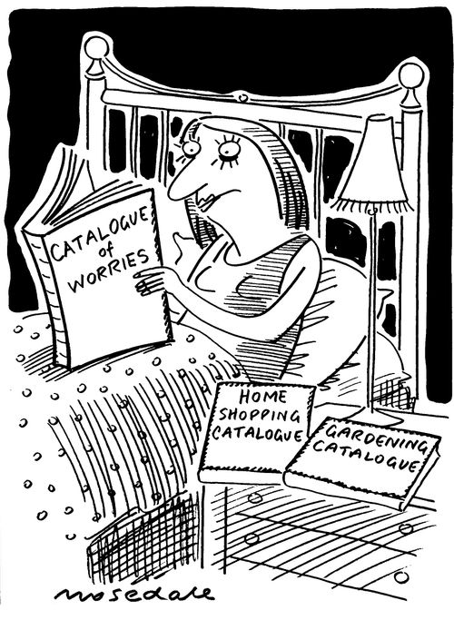 Woman in bed with catalogue of worries.