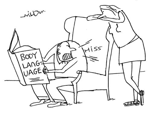 Man reading book on body language hisses at a woman.