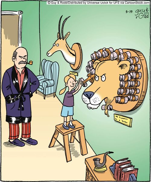 Little girl curling the mane of her father's lion hunting trophy.