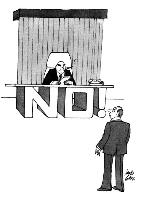 Man has 'NO' built into desk.