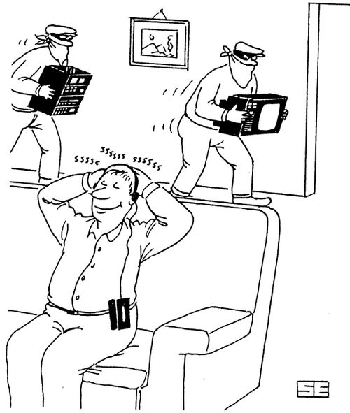 Man being burgled while listening to headphones.