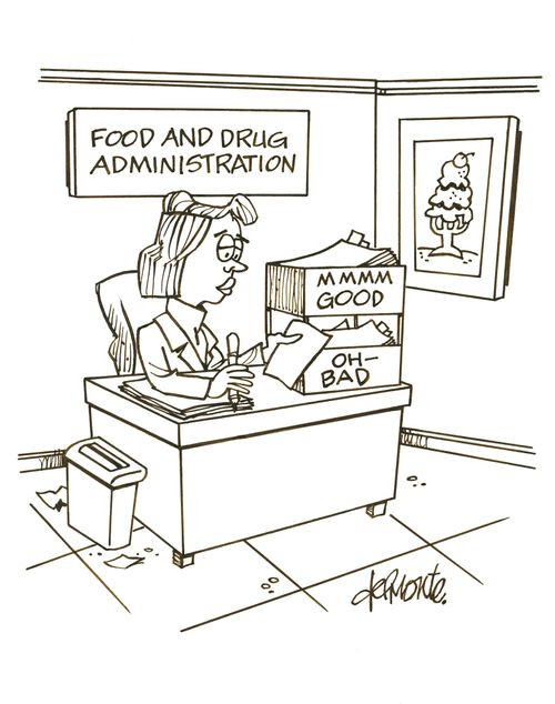 A woman sits in an office of the Food and Drug Administration in - out boxes marked MMMM Good and Oh - Bad.