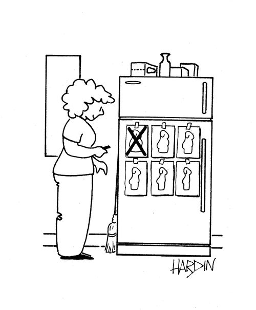 Woman crosses off chart on fridge.