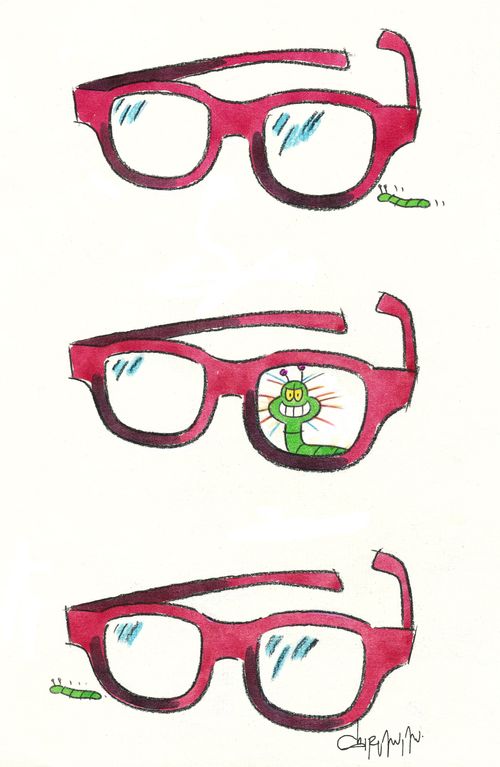Caterpillar being magnified in glasses.