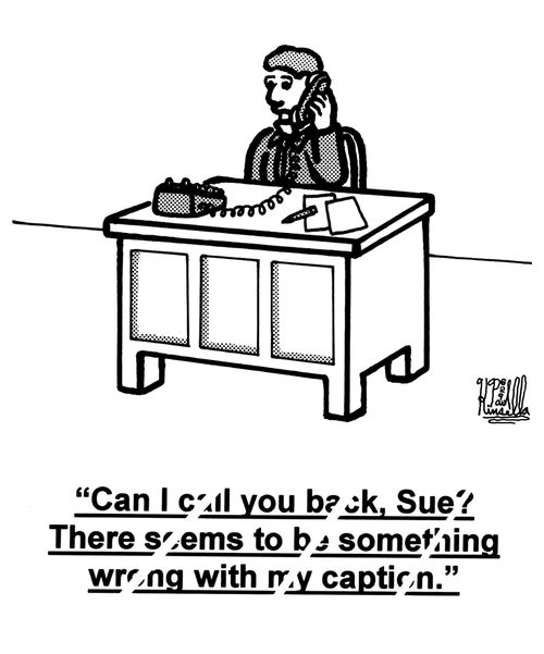 'Can I call you back, Sue? There seems to be something wrong with my caption.' (man at office desk)