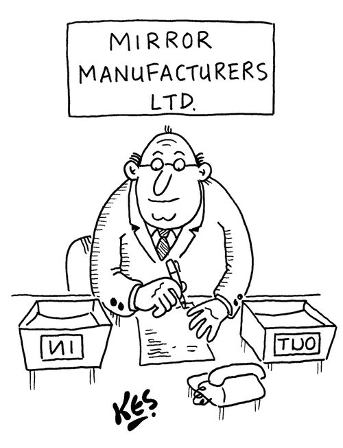 Mirror manufacturers employee is at desk with 'in/out' workboxes in reverse.