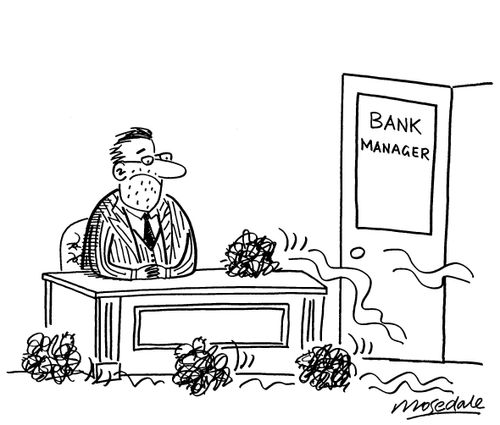 Bank manager with no business has tumbleweed blowing into office.