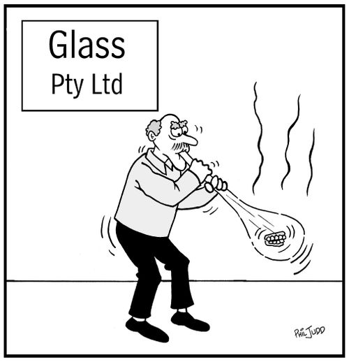 Man blowing glass. His dentures have fallen out and are in the glass bubble.