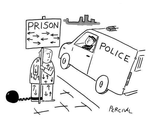 A prisoner holding a sign with arrows pointing in all directions as a police officer looks on from a police van.