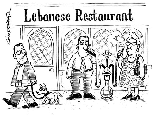 Smoking hookah pipe outside Lebanese restaurant.