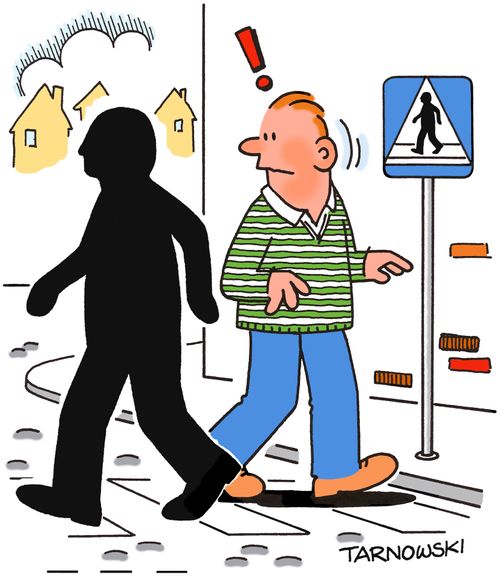 Man from the road sign crossing the street.