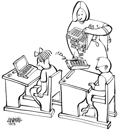 Teacher handing out laptops.