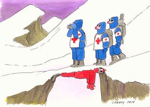 Mountain rescue team standing on the lost climber.