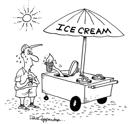 A man is handed an ice cream from within the cart