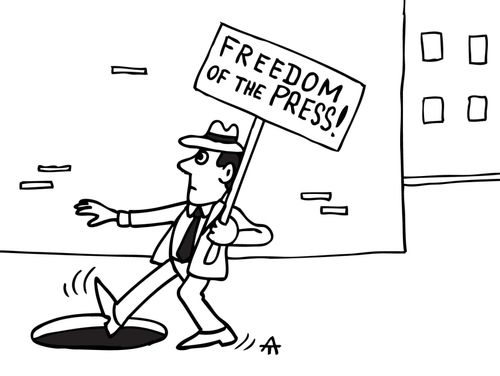 Man holding 'Freedom of the press' placard is about to fall into a manhole.