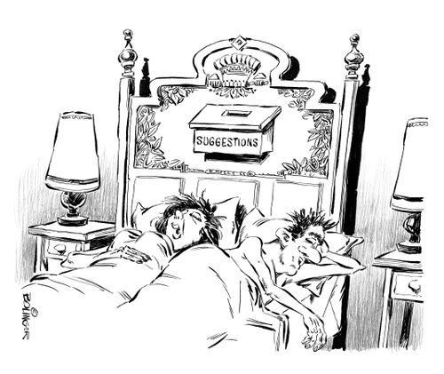 Suggestion box attached to headboard on bed