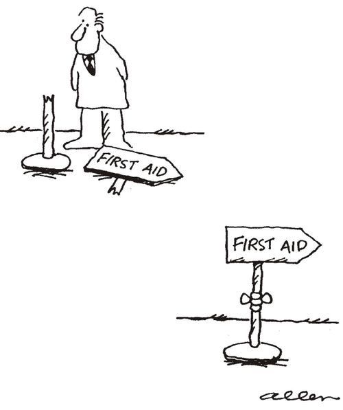 Man mends broken FIRST AID sign with a bandage.