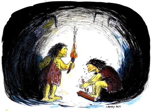 Cavemen make fire, illuminated by lighted torch.