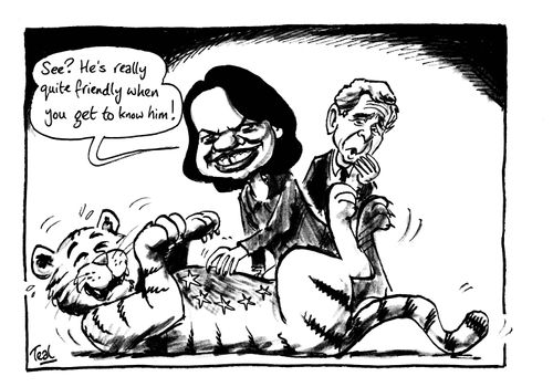 'See?  He's really quite friendly when you get to know him!' Condoleeza Rice tickling the EU tiger.